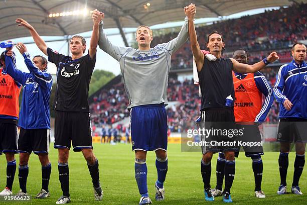 Benedikt Hoewedes, goalkeeper Manuel Neuer and Kevin Kuranyi of Schalke celebrate the 2-1 victory after the Bundesliga match between VfB Stuttgart...