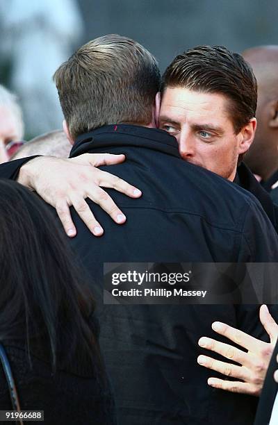 Keith Duffy is comforted at the funeral of Boyzone member Stephen Gately on October 17, 2009 in Dublin, Ireland.