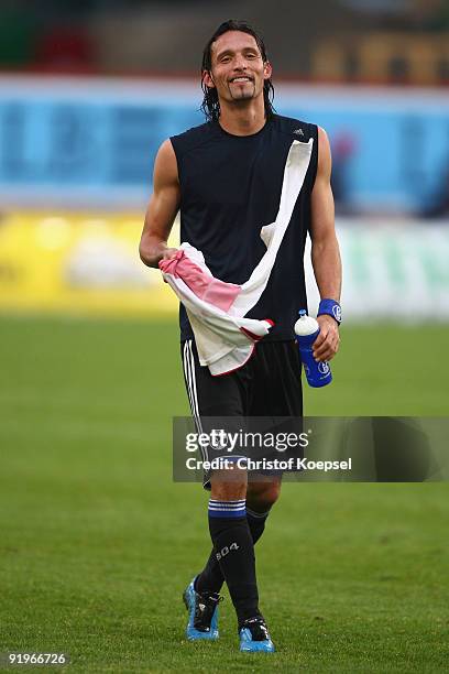 Kevin Kuranyi of Schalke smiles after winning 2-1 the Bundesliga match between VfB Stuttgart and FC Schalke 04 at the Mercedes-Benz Arena on October...