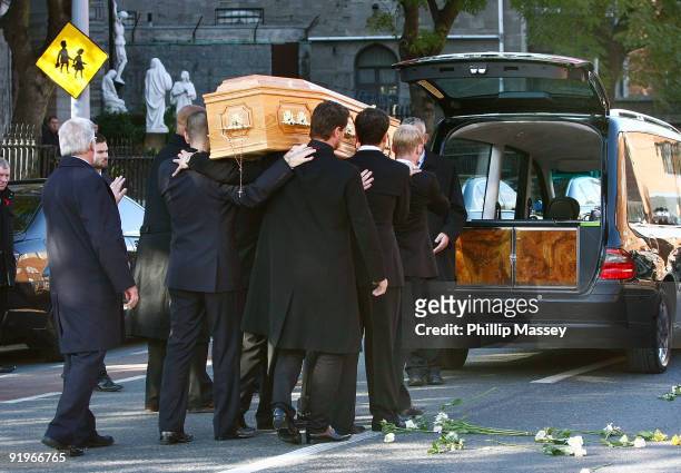 Ronan Keating, Mikey Graham, Keith Duffy and Shane Lynch carry the coffin of Boyzone member Stephen Gately on October 17, 2009 in Dublin, Ireland.
