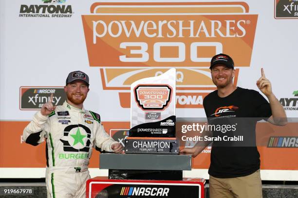 Tyler Reddick, driver of the BurgerFi Chevrolet, and Dale Earnhardt Jr., team owner of JR Motorsports, celebrate with the trophy after winning the...