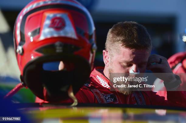 Justin Allgaier, driver of the BRANDT Professional Agriculture Chevrolet, exits his car in the garage area after being involved in an on-track...