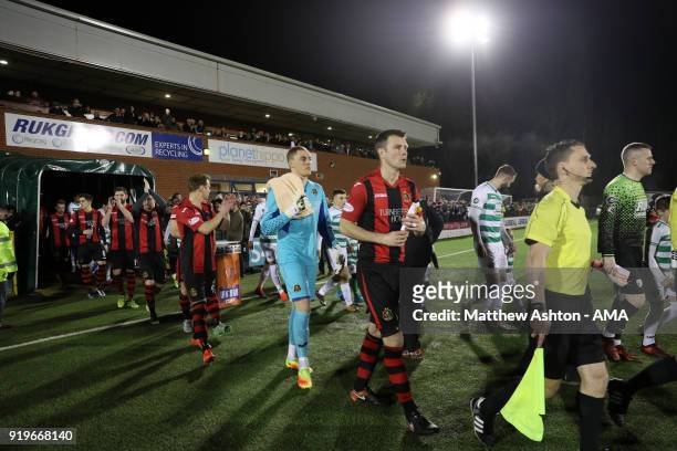 The teams enter the field at Park Hall Stadium during to the Irn Bru Cup Semi-Final match between The New Saints and Dumbarton at Park Hall on...
