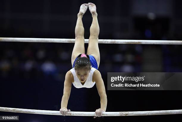 Yong Hwa Cha of North Korea competes in the uneven bars during the Apparatus Finals on the fifth day of the Artistic Gymnastics World Championships...