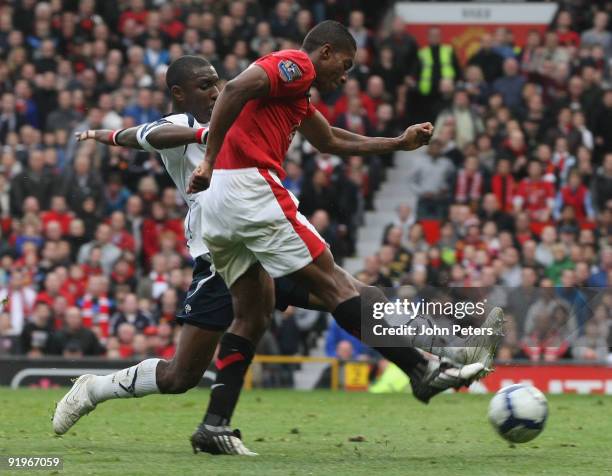 Antonio Valencia of Manchester United clashes with Jlloyd Samuel of Bolton Wanderers during the FA Barclays Premier League match between Manchester...