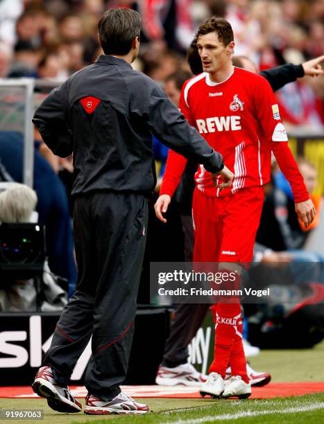 Milivoje Novakovic of Koeln and head coach Zvonimir Soldo are pictured during the Bundesliga match between 1. FC Koeln and FSV Mainz 05 at...