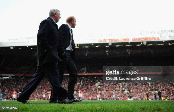 Sir Alex Ferguson of Manchester United walks out with Gary Megson of Bolton during the Barclays Premier League match between Manchester United and...