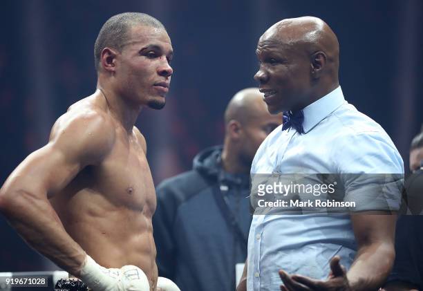 Chris Eubank JR of England speaks with his father Chris Eubank Snr following his WBSS Super Middleweight bout against George Groves of England at the...