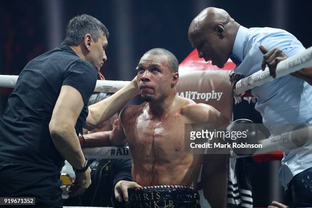 Chris Eubank JR of England speaks with his father Chris Eubank Snr between rounds during his WBSS Super Middleweight bout against George Groves of...