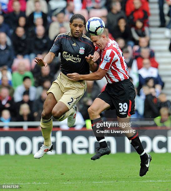 Glen Johnson of Liverpool competes with Lee Cattermole of Sunderland during the Barclays Premier League match between Sunderland and Liverpool at the...