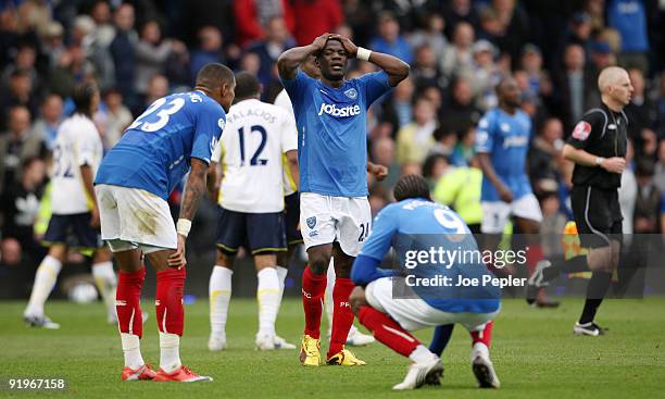 Kevin-Prince Boateng, Aruna Dindane and Frederick Piquionne of Portsmouth dejected after the Barclays Premier League match between Portsmouth and...