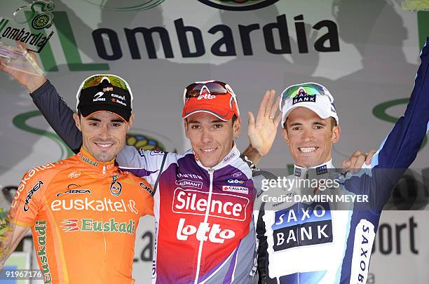 Winner Belgian Philippe Gilbert , second placed Spaniard Samuel Sanchez and third placed Russian Alexandr Kolobnev celebrate on the podium of the...