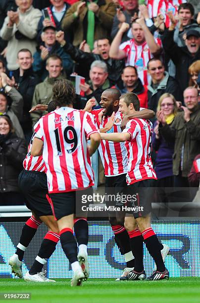 Darren Bent of Sunderland celebrates with team mates after scoring during the Barclays Premier League match between Sunderland and Liverpool at the...