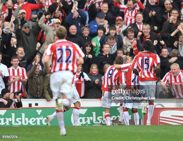 James Beattie of Stoke celebrates scoring their second goal as he kicks the advertising board during the Barclays Premier League match between Stoke...