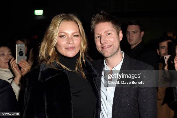 Designer Christopher Bailey and model Kate Moss wearing Burberry at the Burberry February 2018 show during London Fashion Week at Dimco Buildings on...