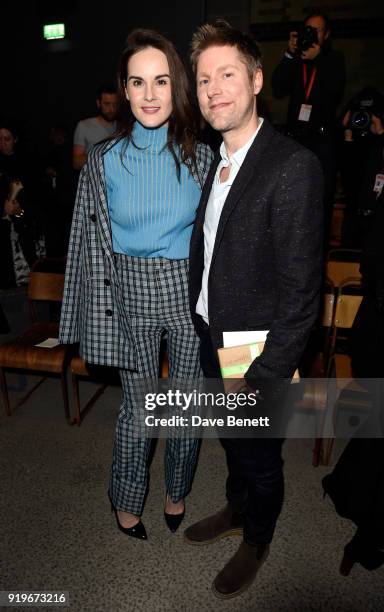 Designer Christopher Bailey and Michelle Dockery are seen following the Burberry February 2018 show during London Fashion Week at Dimco Buildings on...