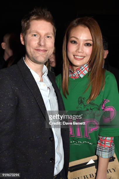 Designer Christopher Bailey and Joey Yung are seen following the Burberry February 2018 show during London Fashion Week at Dimco Buildings on...