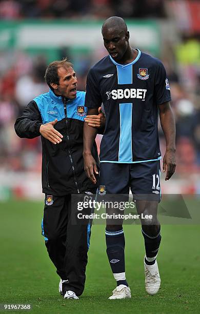 Manager Gianfranco Zola of West Ham talks to Carlton Cole at half time during the Barclays Premier League match between Stoke City and West Ham...