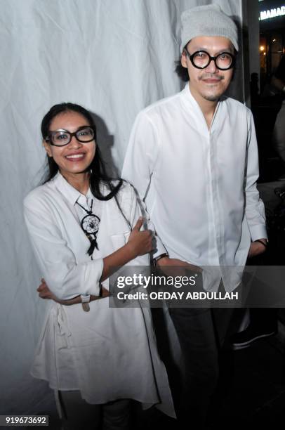 This picture taken on February 17, 2018 shows Indonesian singing duo Endah Widiastuti and Rhesa Aditya posing after a performance in Jakarta. / AFP...