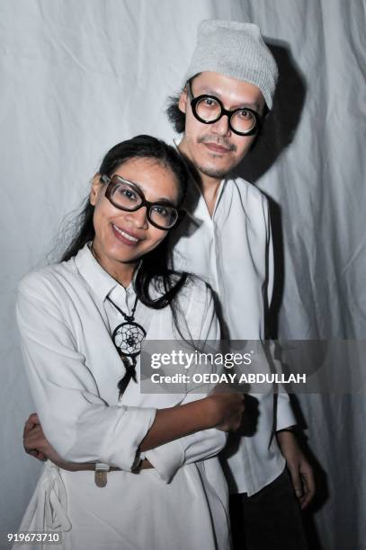 This picture taken on February 17, 2018 shows Indonesian singing duo Endah Widiastuti and Rhesa Aditya posing after a performance in Jakarta. / AFP...