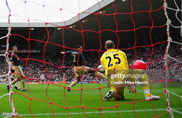 Darren Bent of Sunderland shot on goal deflects off of a balloon as Pepe Reina of Liverpool fails to save the Barclays Premier League match between...