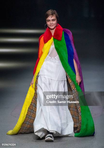 Cara Delevingne walks the runway at the Burberry show during London Fashion Week February 2018 at Dimco Buildings on February 17, 2018 in London,...