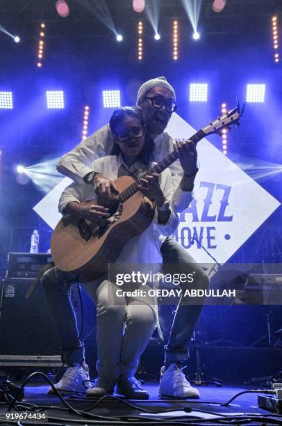 This picture taken on February 17, 2018 shows Indonesian singing duo Endah Widiastuti and Rhesa Aditya, known as Endah N Rhesa, performing in...