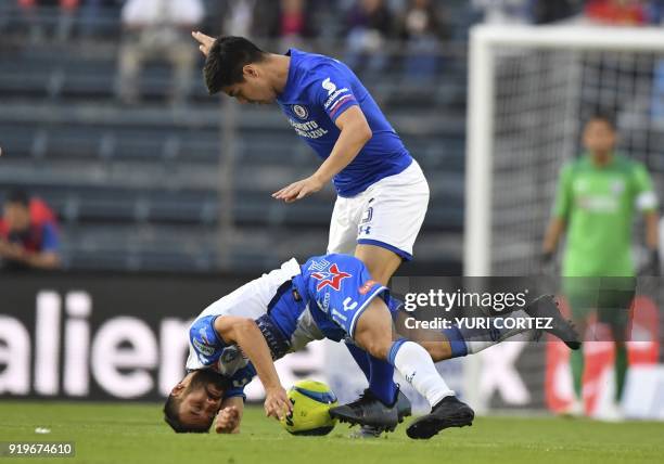 Cruz azul's midfielder Chilean Francisco Silva vies for the ball with Puebla's midfielder Jose Guerrero during their Mexican Clausura 2018 tournament...