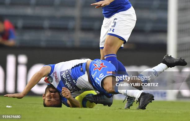 Cruz azul's midfielder Chilean Francisco Silva vies for the ball with Puebla's midfielder Jose Guerrero during their Mexican Clausura 2018 tournament...