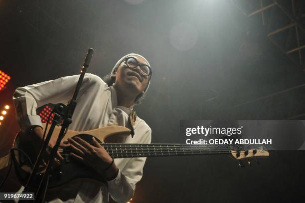 This picture taken on February 17, 2018 shows Rhesa Aditya from the Indonesian singing duo Endah N Rhesa, performing in Jakarta. / AFP PHOTO / Oeday...