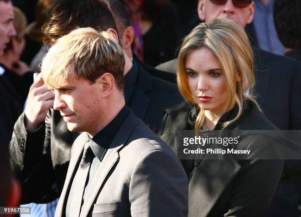 Westlife's Kian Egan and Jodi Albert attends the funeral of Boyzone member Stephen Gately on October 17, 2009 in Dublin, Ireland.