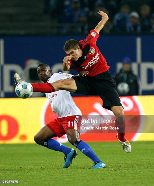 Eljero Elia of Hamburg and Daniel Schwaab of Leverkusen battle for the ball during the Bundesliga match between Hamburger SV and Bayer Leverkusen at...