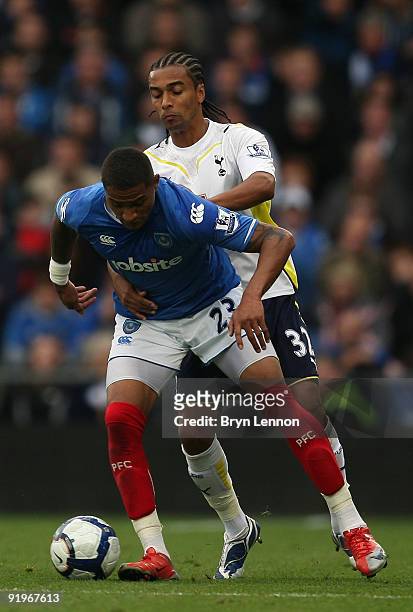 Benoit Assou-Ekotto of Tottenham Hotspur is tackles Kevin Prince-Boateng of Portsmouth during the Barclays Premier League match between Portsmouth...