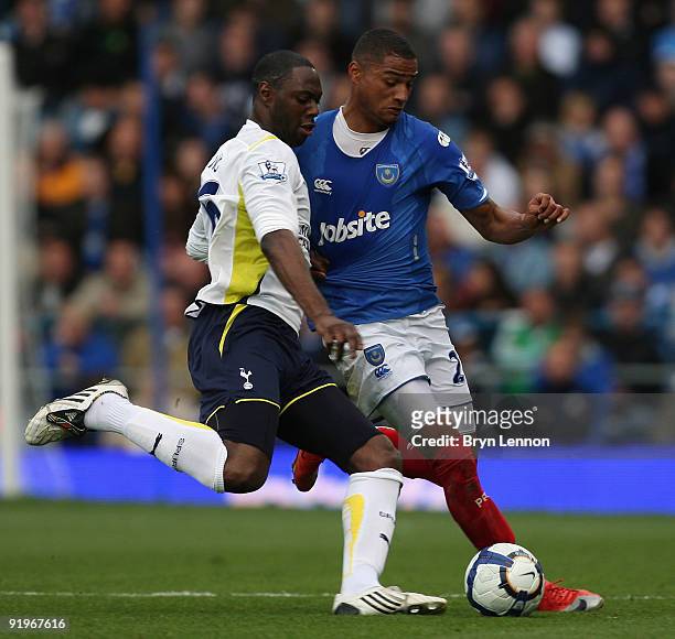 Ledley King of Tottenham Hotspur tackles Kevin-Prince Boateng of Portsmouth during the Barclays Premier League match between Portsmouth and Tottenham...