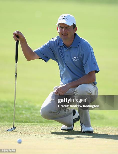 Peter Lawrie of Ireland lines up a putt on the 17th hole during the third round of the Portugal Masters at the Oceanico Victoria Golf Course on...