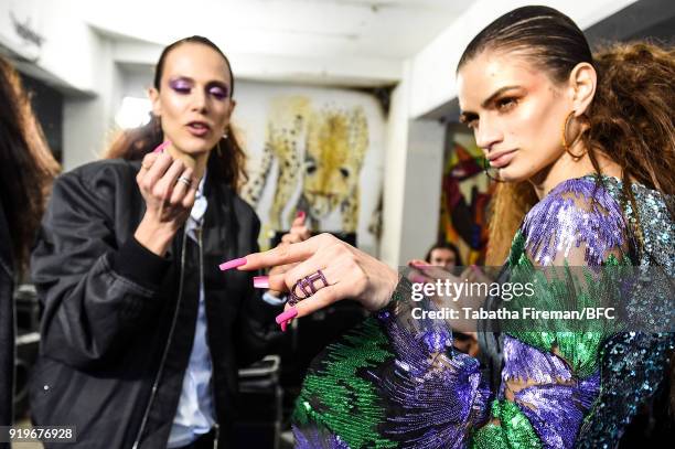 Model backstage ahead of the Halpern show during London Fashion Week February 2018 on February 17, 2018 in London, England.