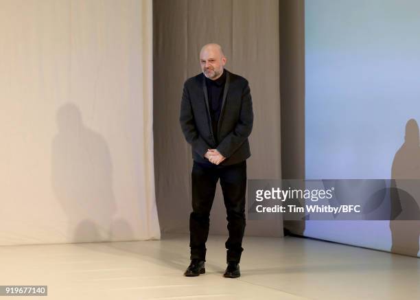 Hussein Chalayan takes a bow at the Chalayan show during London Fashion Week February 2018 at Sadlers Wells Theatre on February 17, 2018 in London,...