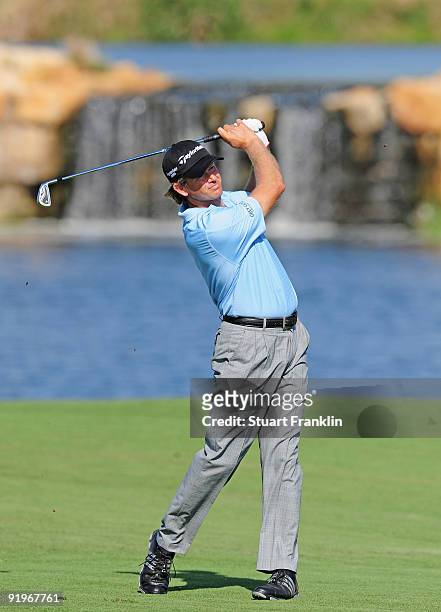 Retief Goosen of South Africa plays his approach shot on the seventh hole during the third round of the Portugal Masters at the Oceanico Victoria...