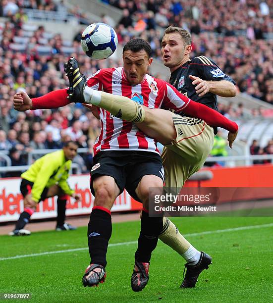 Steed Malbranque of Sunderland is challenged by Fabio Aurelio of Liverpool during the Barclays Premier League match between Sunderland and Liverpool...