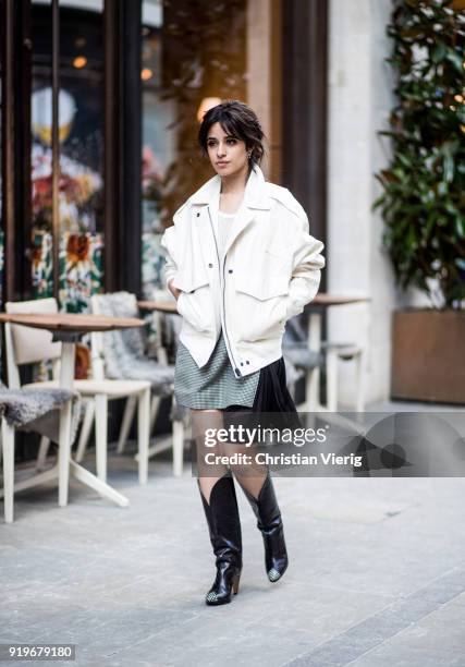 Singer Camila Cabello wearing total look Givenchy including jacket, skirt and boots seen during London Fashion Week February 2018 on February 17,...