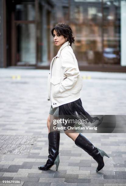 Singer Camila Cabello wearing total look Givenchy including jacket, skirt and boots seen during London Fashion Week February 2018 on February 17,...