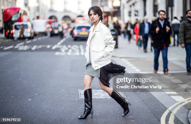 Singer Camila Cabello wearing total look Givenchy including jacket, skirt and boots seen during London Fashion Week February 2018 on February 17,...