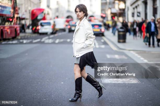 Singer Camila Cabello wearing total look Givenchy including jacket, skirt and boots seen during London Fashion Week February 2018 on February 17,...