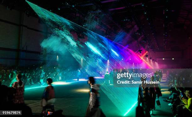 General view as models walk the runway at the Burberry show during London Fashion Week February 2018 at Dimco Buildings on February 17, 2018 in...