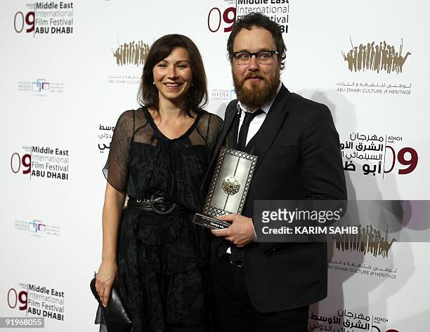 Australian filmmaker Glendyn Ivin holds his Black Pearl award for best new narrative director during the closing ceremony of the third annual Middle...