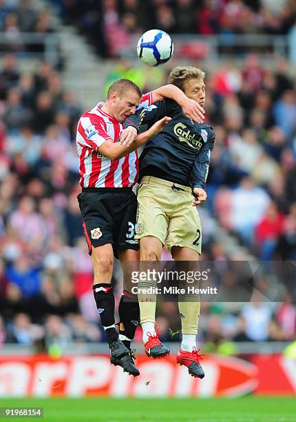 Lee Cattermole of Sunderland challenges Lucas Leiva of Liverpool uring the Barclays Premier League match between Sunderland and Liverpool at the...