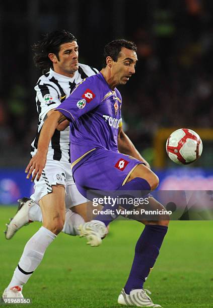 Vincenzo Iaquinta of Juventus FC battles for the ball with Dario Dainelli of ACF Fiorentina during the Serie A match between Juventus FC and ACF...