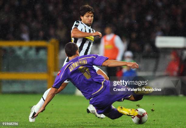 Ribas Da Cunha Diego of Juventus FC is challenged by Alessandro Gamberini of ACF Fiorentina during the Serie A match between Juventus FC and ACF...