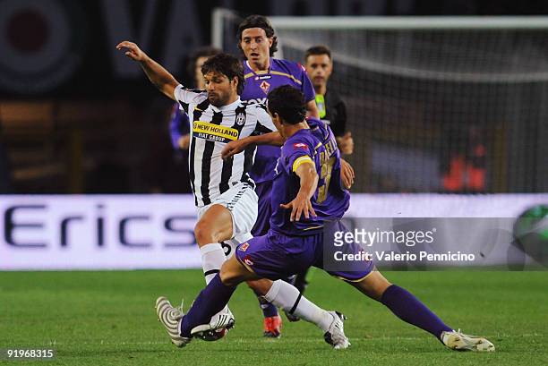 Ribas Da Cunha Diego of Juventus FC is challenged by Dario Dainelli of ACF Fiorentina during the Serie A match between Juventus FC and ACF Fiorentina...