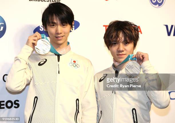 Gold Medalist Figure Skater Yuzuru Hanyu of Japan and Silver Medalist Figure Skater Shoma Uno of Japan pose with their medals during a press...